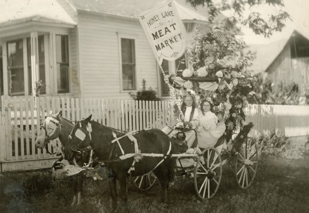 Honey Lake Meat Market's 1906 parade entry featuring Leona Jackson and Mary Fern Long. It was taken at the corner of Union and Cottage Streets. The barn in the background was torn down and replaced with the St. Francis Hotel. Courtesy of Leona Byars